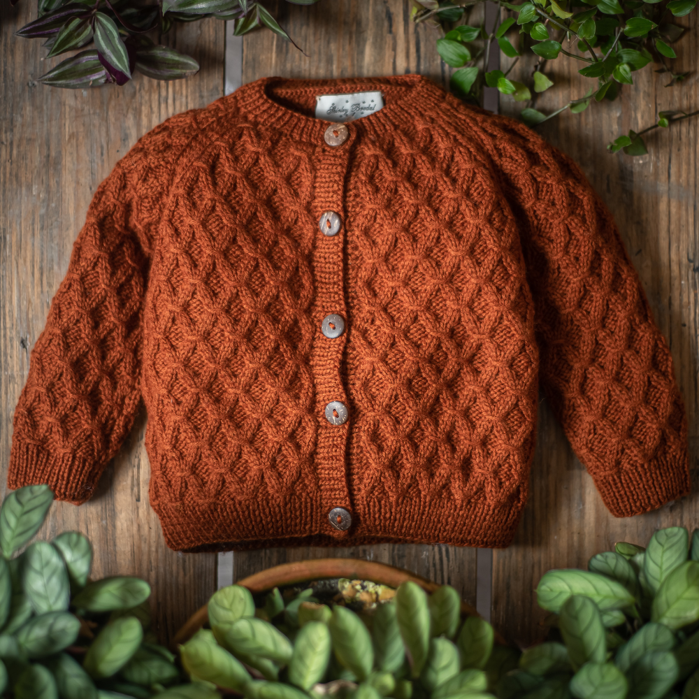 Smock cardigan Rust Hand-knitted merino wool baby cardigan