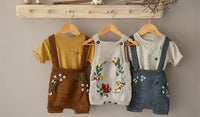 Hand knitted and embroidered collection of kids and baby clothes