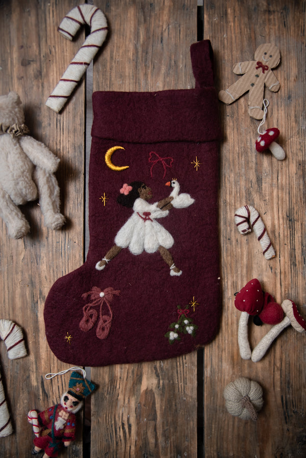 Dark grape holiday stocking with embroidered Odette and festive motifs displayed in a Christmas setting, adding elegance and charm to holiday decor.