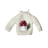 Knitted Sweater Ornament featuring an embroidered mushroom motif, displayed in a festive setting, showcasing its charming design and detail.