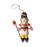 Nutcracker ornament in cream with intricate embroidery and whimsical details