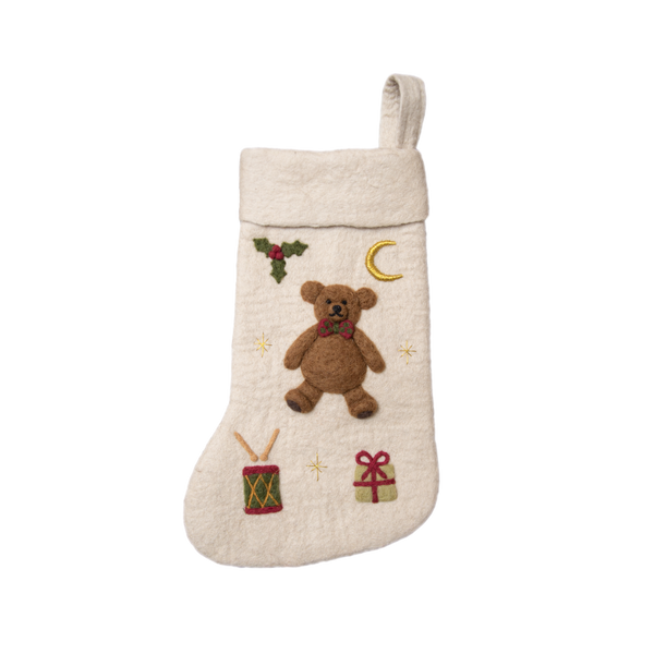 Fully handcrafted cream white holiday stocking featuring a meticulously embroidered teddy bear, made from 100% wool. A charming addition to festive decor.