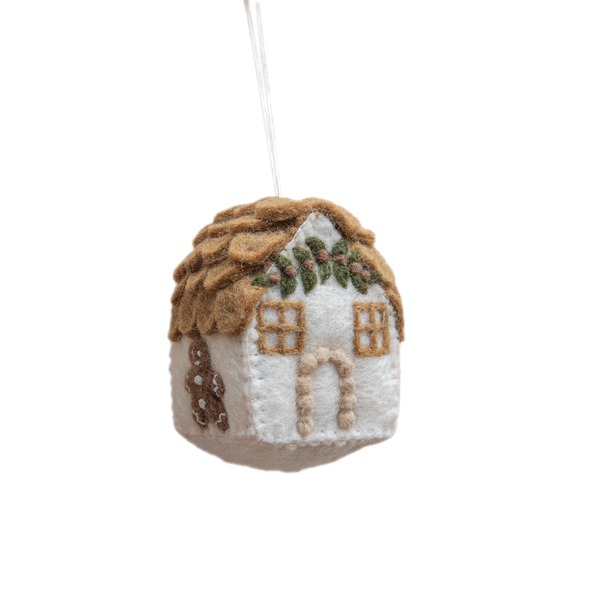 Handcrafted gingerbread house ornament in white, featuring intricate details and festive charm, made from 100% wool. A whimsical addition to holiday decor, showcasing meticulous craftsmanship and traditional warmth.