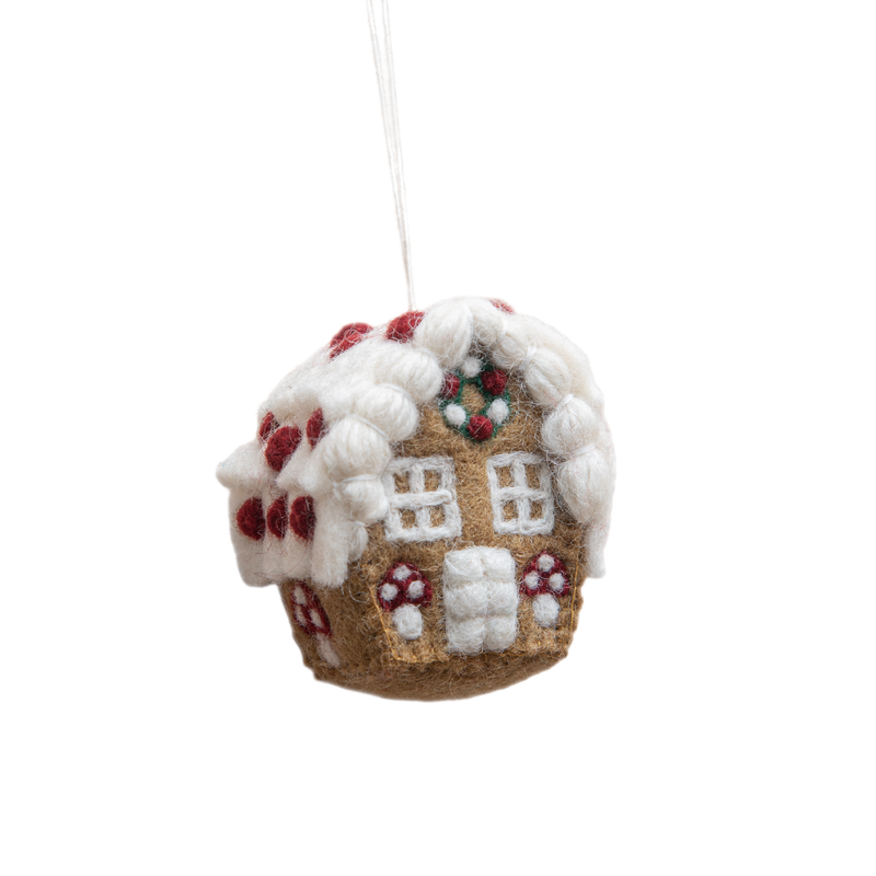 Handcrafted gingerbread house ornament with a whimsical mushroom detail, featuring intricate embroidery and punch needle accents. The ornament is made from 100% wool, adding a charming and festive touch to holiday decor.