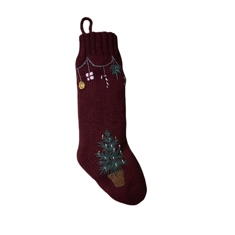 Garland Stocking in Dark Grape color featuring a beautiful basket with a Christmas tree and garland with festive elements, showcasing traditional holiday design.