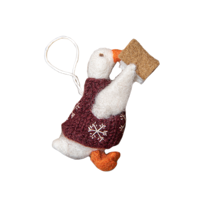 Felted goose ornament with red vest, showing intricate craftsmanship and soft texture.