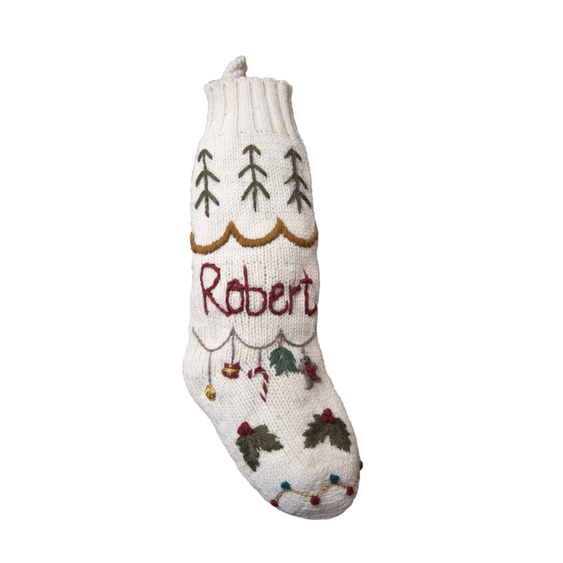 white personalized knitted stocking with hand embroidered holiday motifs