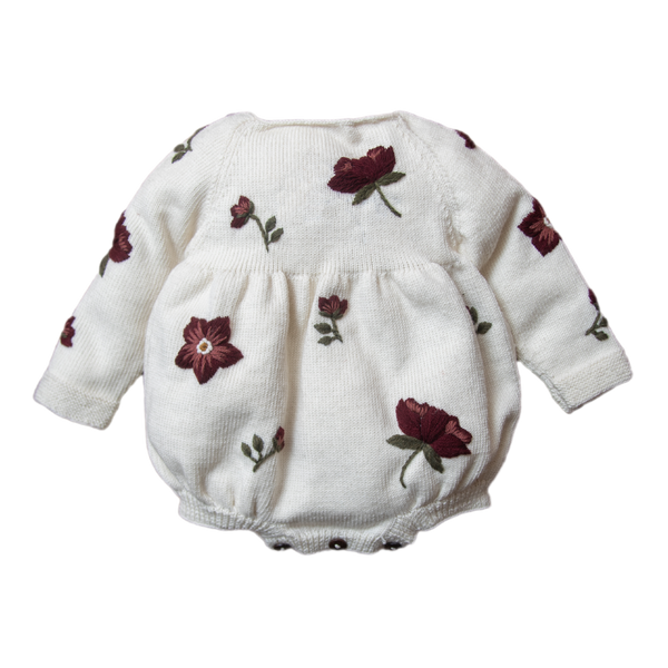 knitted and embroidered hellebores romper for babies