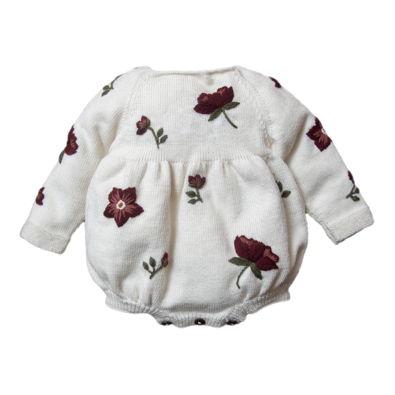 knitted and embroidered hellebores romper for babies