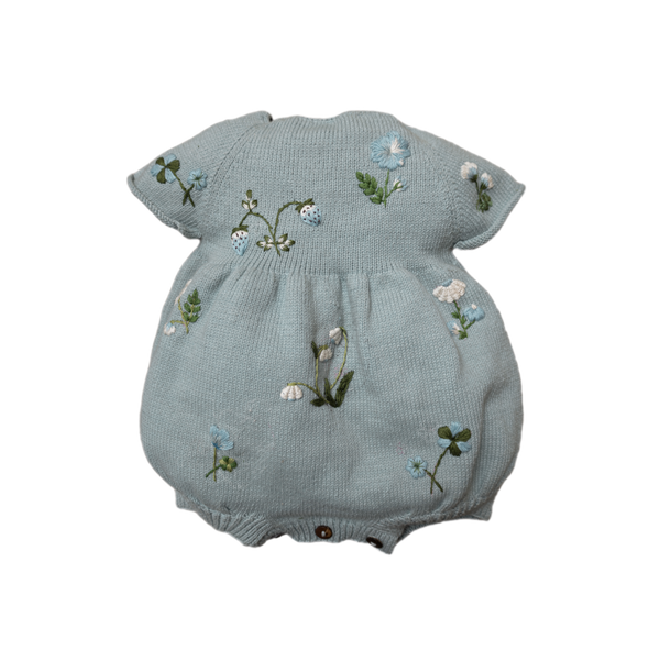 blue knitted and hand embroidered botanical romper