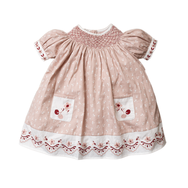 pink sewn dress for kids with handcrafted details