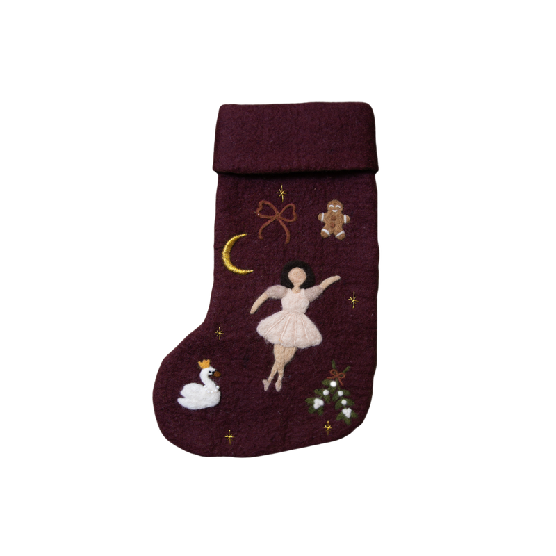 Fully handcrafted dark grape holiday stocking featuring an embroidered ballerina and enchanting holiday motifs, made from 100% wool.