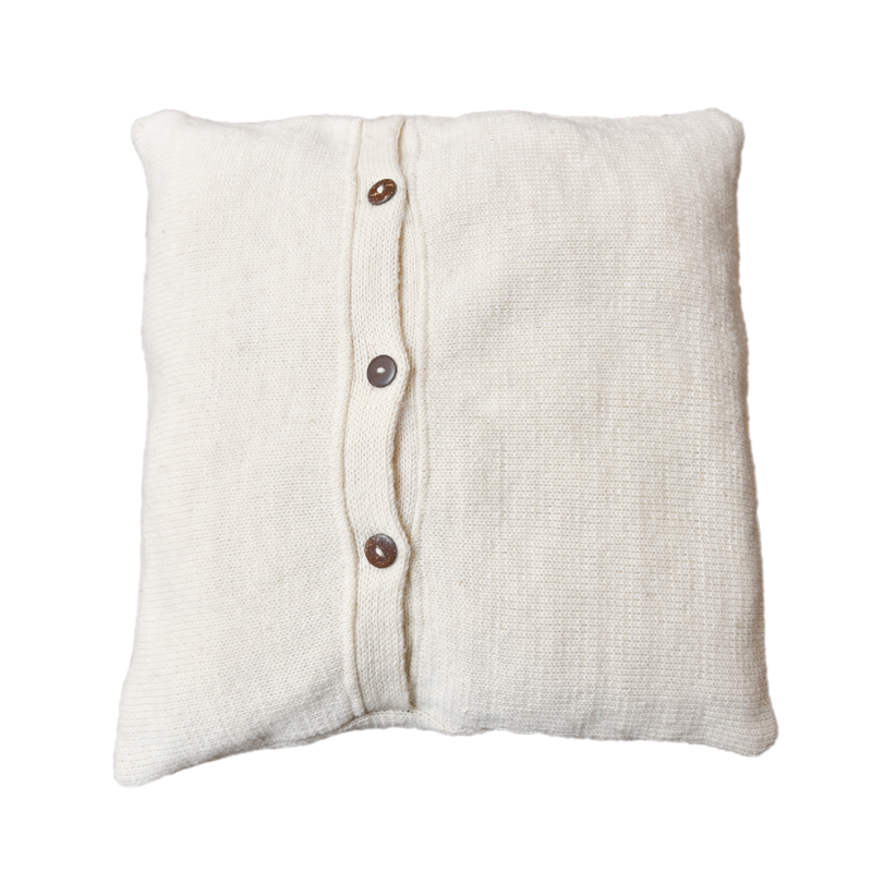 the backside of our knitted  and embroidered joy pillow cover