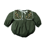 A green romper for babies, featuring a generously sized collar with intricate embroidery of birds and floral motifs.