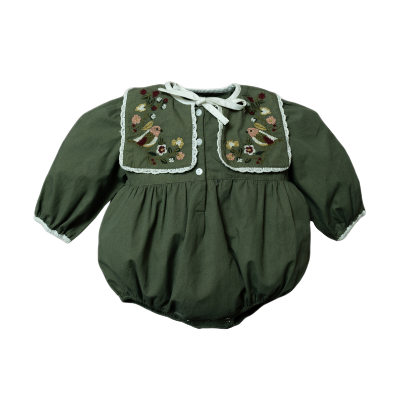 A green romper for babies, featuring a generously sized collar with intricate embroidery of birds and floral motifs.