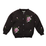 A black knit cardigan sweater with pink and white floral embroidery and green leaves, featuring a button-up front and ribbed cuffs and hem.