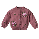A dusty rose knit cardigan sweater with embroidered pink and white roses and green leaves on the front, featuring a button-up closure and ribbed cuffs and hem.