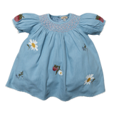 Light blue smocked baby dress with floral embroidery and puff sleeves