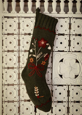 Decorative sock with floral patterns on a patterned surface