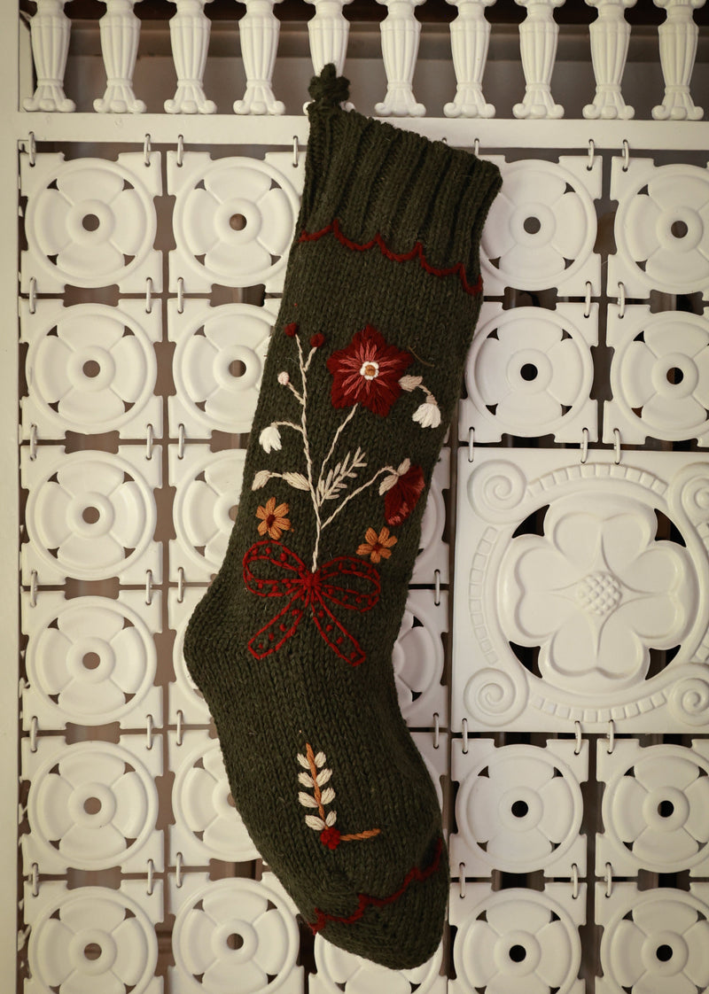 Decorative sock with floral patterns on a patterned surface