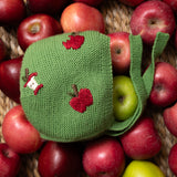 green baby bonnet with hand embroidered apples