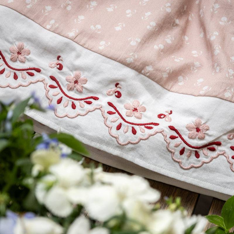 pink sewn dress for kids with handcrafted details