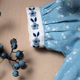 blue sewn dress for kids with handcrafted details