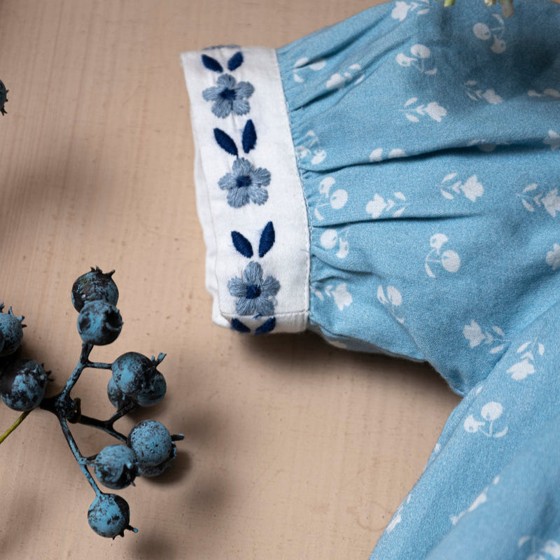 blue sewn dress for kids with handcrafted details