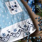 blue sewn dress for kids with handcrafted details