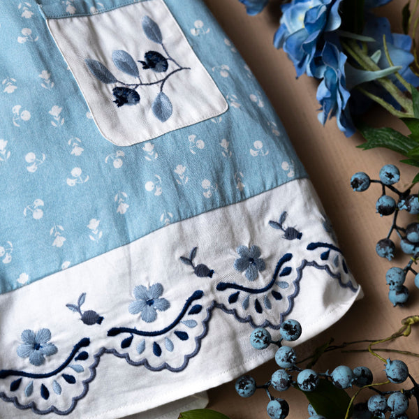 blue sewn dress for kids with handcrafted details