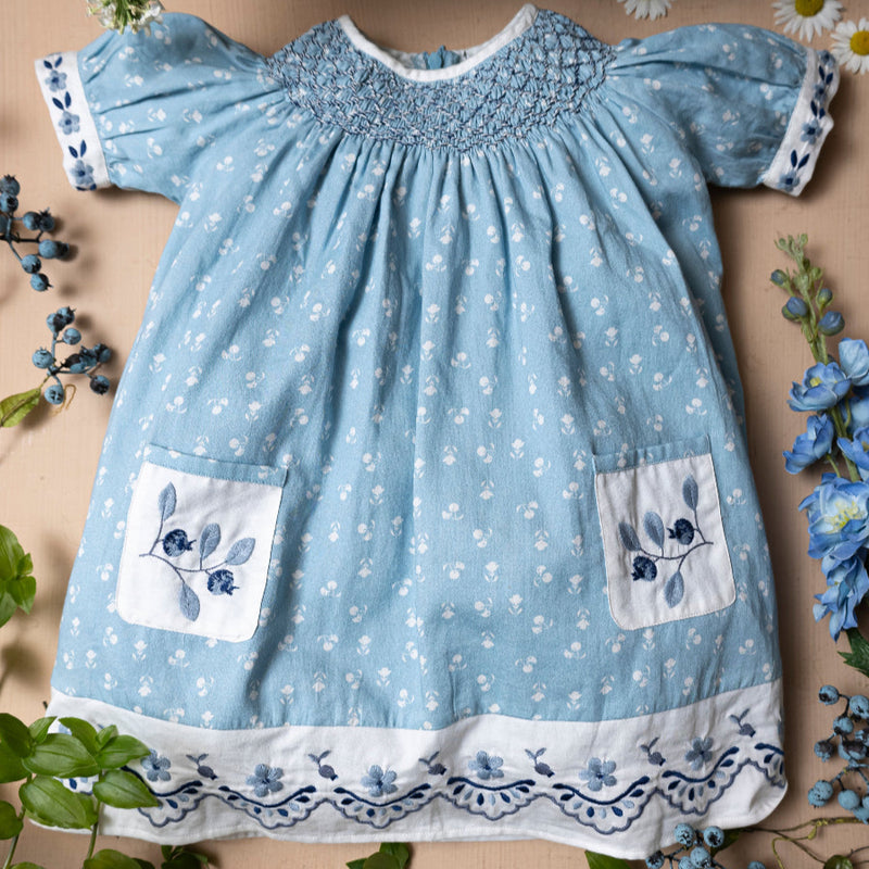 blue sewn dress for kids with handcrafted details