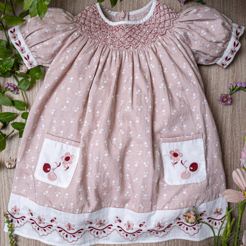 pink sewn dress for kids with handcrafted details