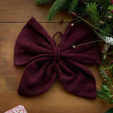 Big Christmas Bow in Grape color as part of a festive holiday display, showcasing its versatility and traditional Christmas appeal.