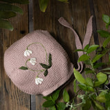 knitted and hand embroidered botanical bonnet