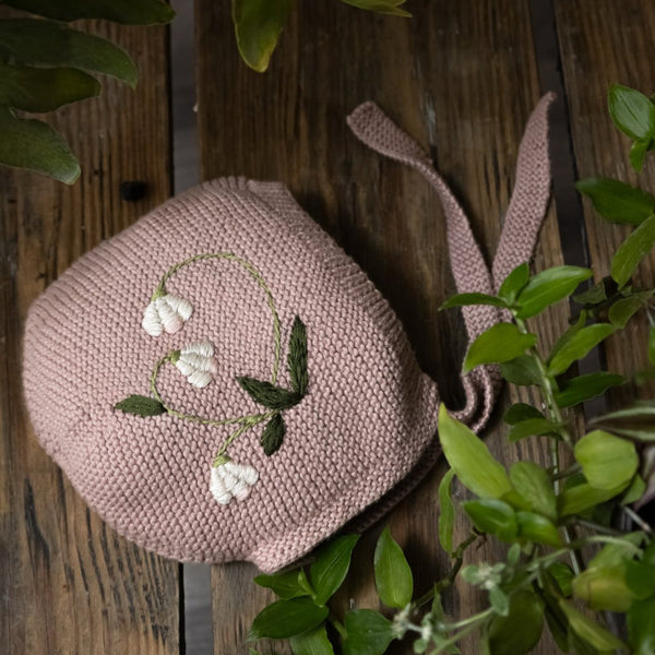 knitted and hand embroidered botanical bonnet