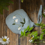 knitted and hand embroidered botanical bonnet