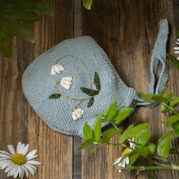 knitted and hand embroidered botanical bonnet