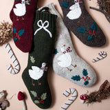 Collection of Goose Stockings in various colors, featuring hand-embroidered Christmas goose designs