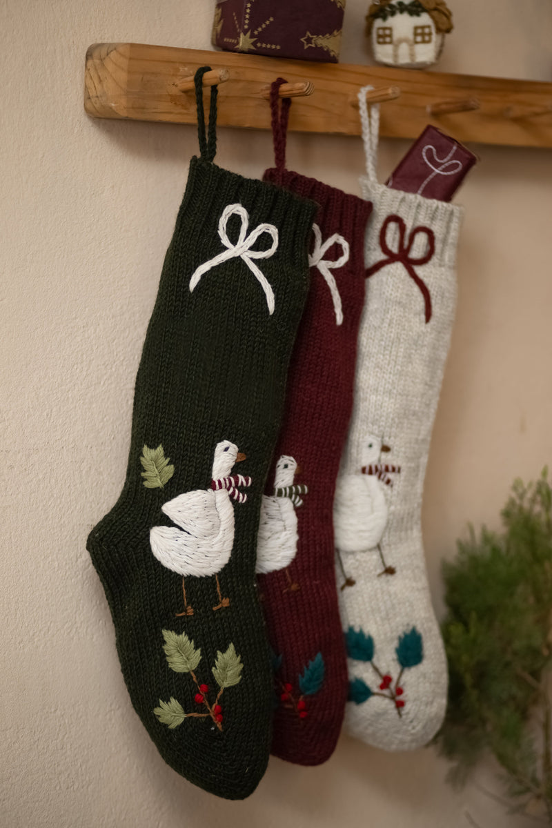 knitted and embroidered goose stockings hanging