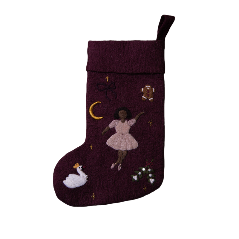 Fully handcrafted dark grape holiday stocking featuring an embroidered ballerina and enchanting holiday motifs, made from 100% wool.