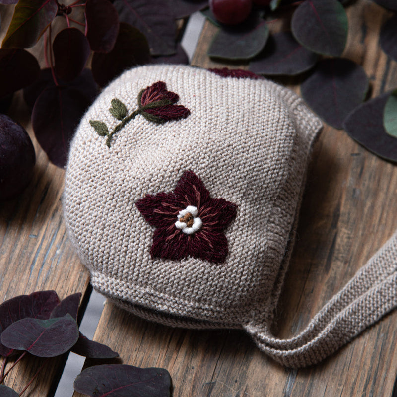 knitted and embroidered hellebores bonnet