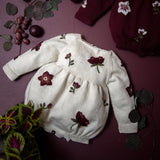 knitted and embroidered hellebores romper for babies