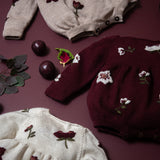 KNITTED AND EMBROIDERED HELLEBORES ROMPERS