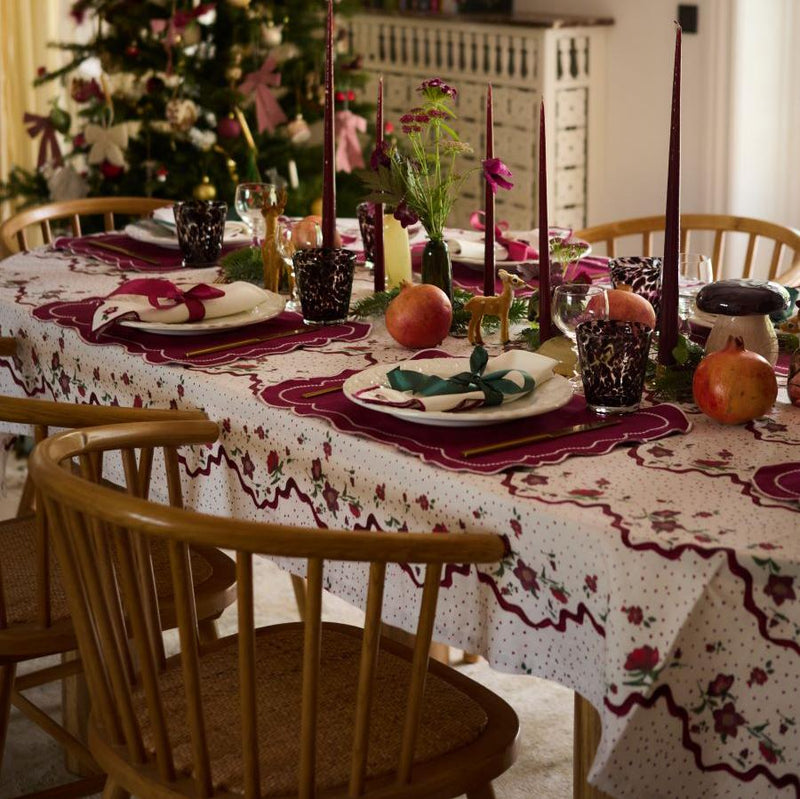 Hellebores Christmas tablecloth displayed in different angles, demonstrating its design versatility and suitability for various holiday settings.