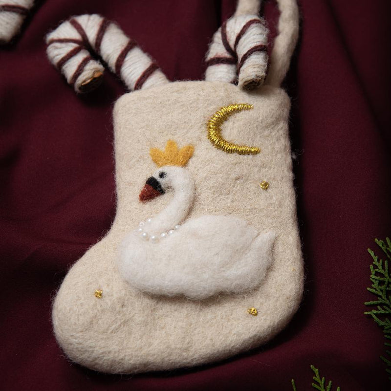 hand felted mini stocking for christmas with a swan on it