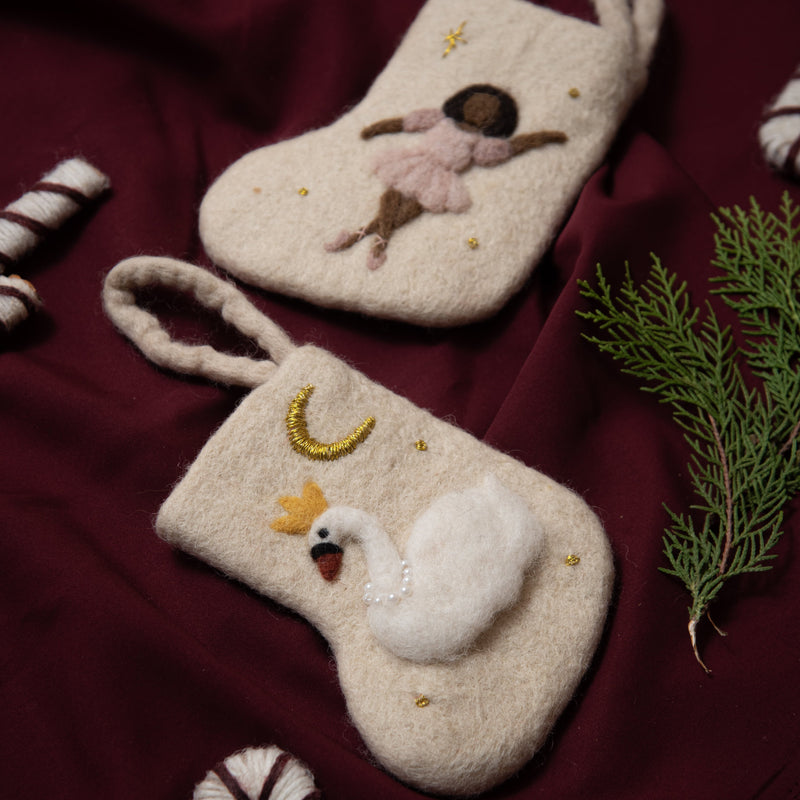 hand felted mini stocking for christmas with a swan on it