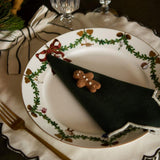 Bow placemat in cream white displayed on a table with holiday decor, highlighting the festive bows and the timeless versatility of the placemats for various occasions.