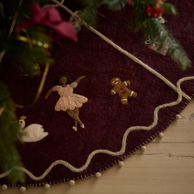 Close-up of whimsical ballerinas on Odette Heirloom Tree Rug, highlighting intricate handcrafted details.