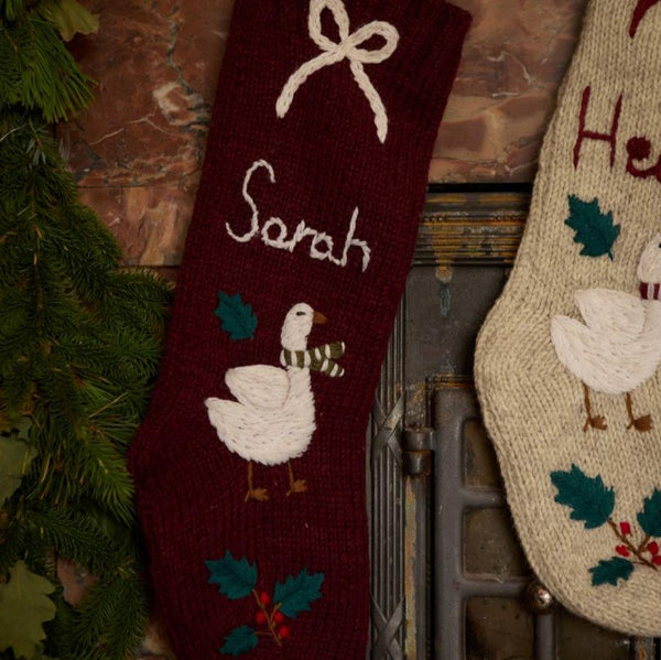 Personalized Goose Stocking in Dark Grape color displayed on a fireplace mantle, featuring custom name embroidery and festive goose design.