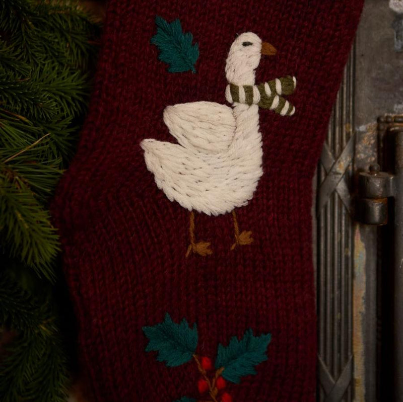 Close-up of hand-embroidered Christmas goose with scarf on Goose Stocking in Dark Grape color.